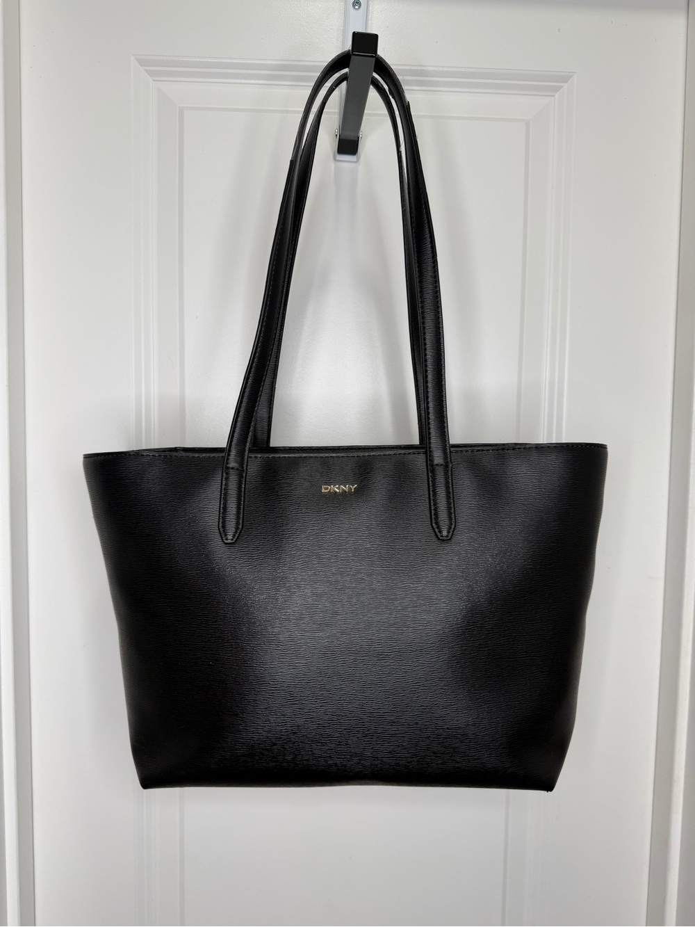 DKNY Bryant medium black leather tote bag with gold-tone logo hardware